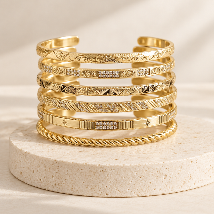 Atelier seven-piece engraved gold-tone bangle stack